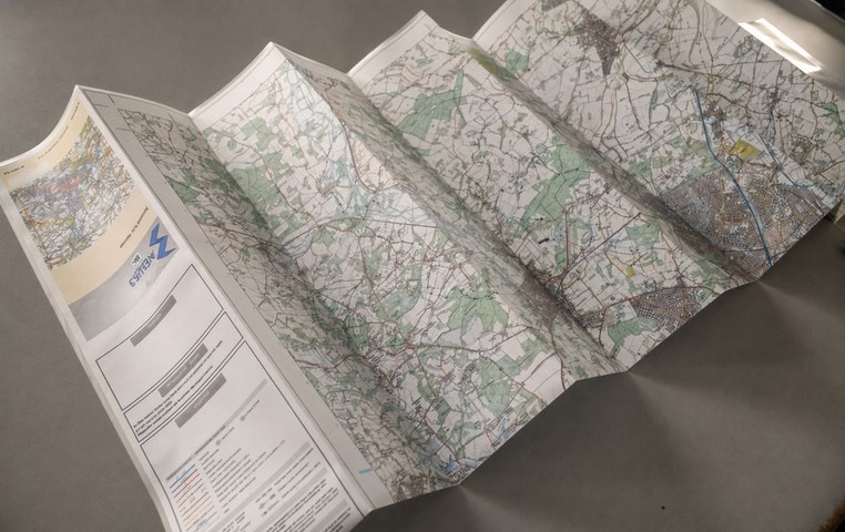 Aqua3 laminated map being folded by hand